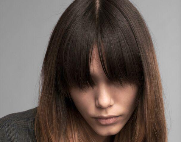 Woman receiving hair treatment