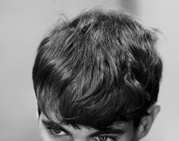 Zoomed in shot of man's mousy brown hair