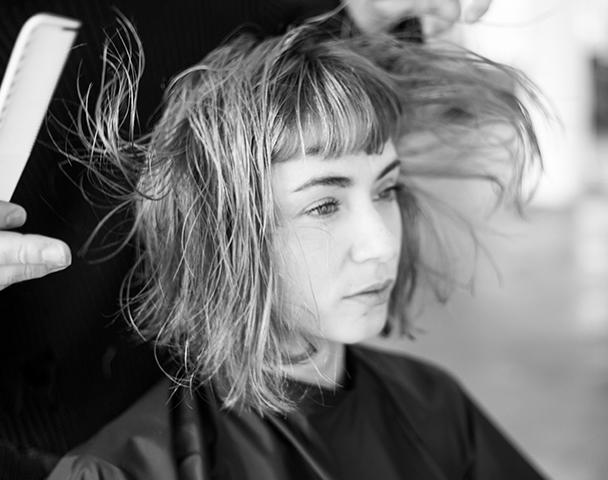 Woman receiving hair treatment
