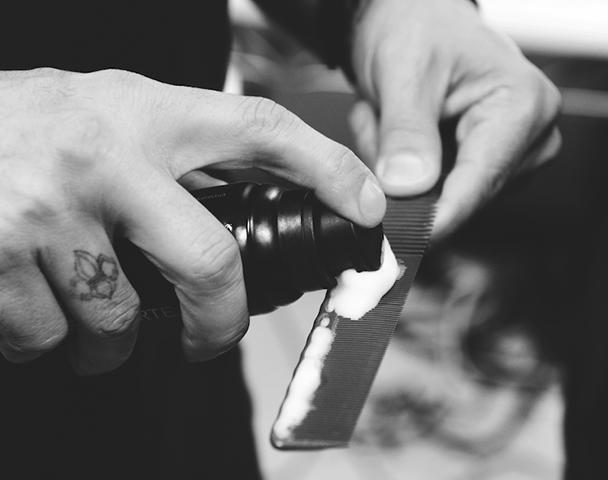 Hair product being applied to a tool