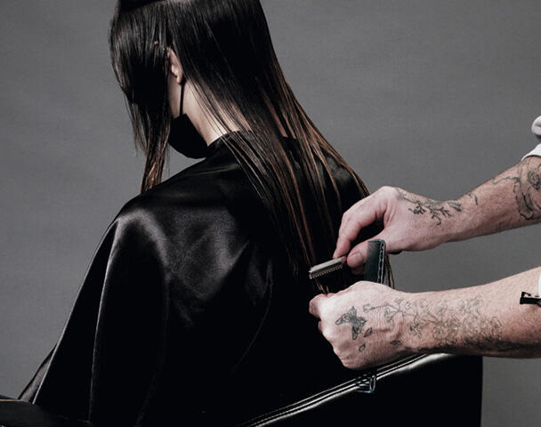 Woman with short hair and a fringe having her hair styled